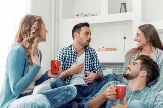 a group of four people having a conversation