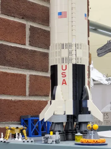a closeup view of the LEGO model Apollo 11 rocket currently on display in the kid's room