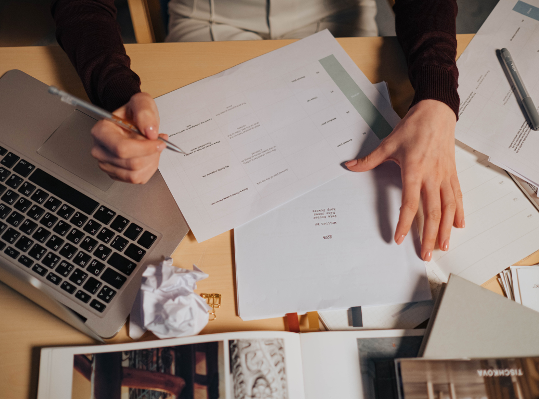 someone looking at a printed document