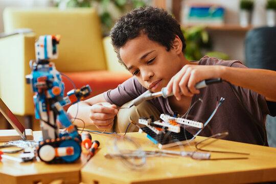 Kid building a robot